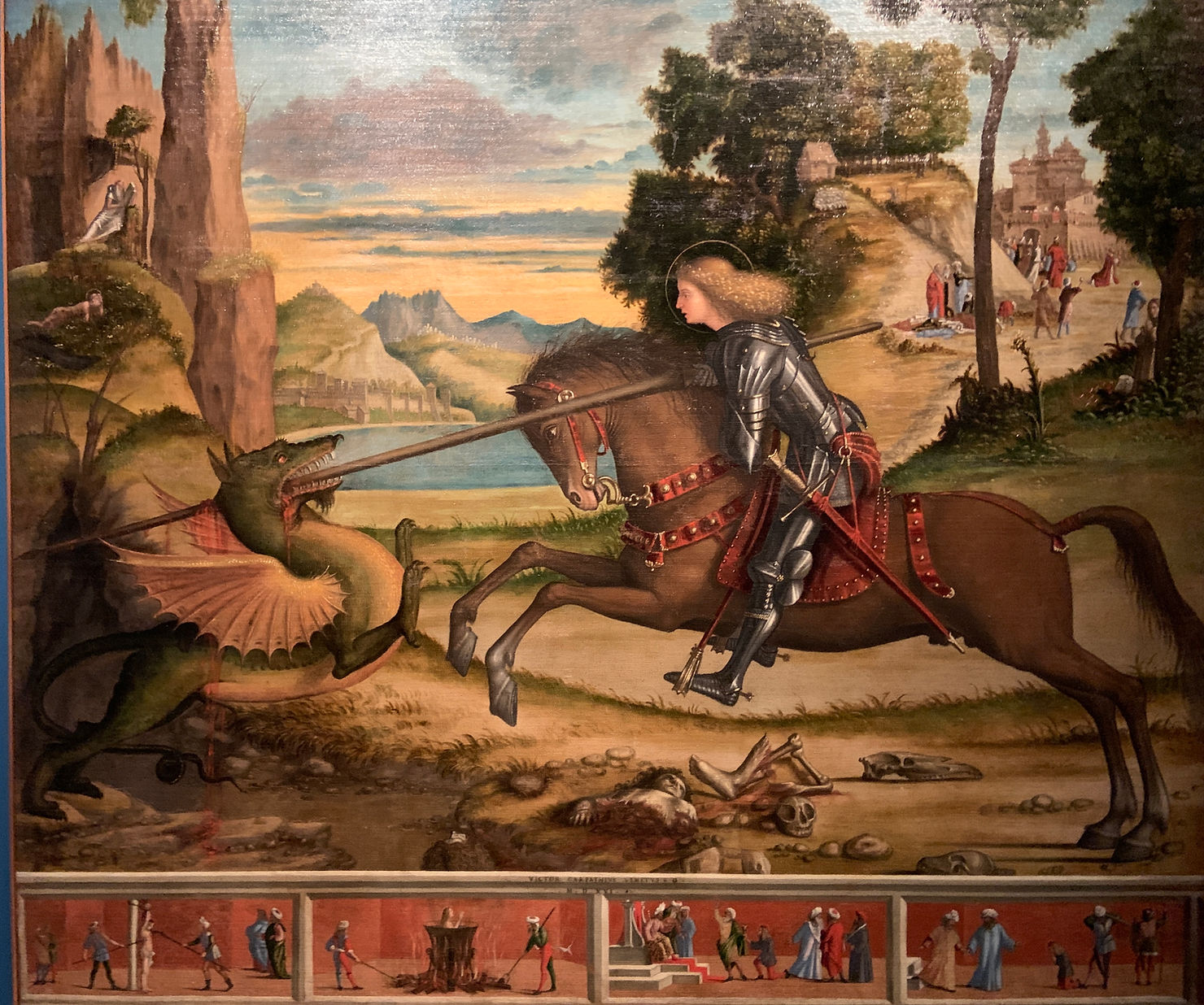 Vittore Carpaccio "San Giorgio che uccide il drago e quattro scene del suo martirio" 1516, olio su tela, Abbazia di San Giorgio Maggiore, Venezia. "